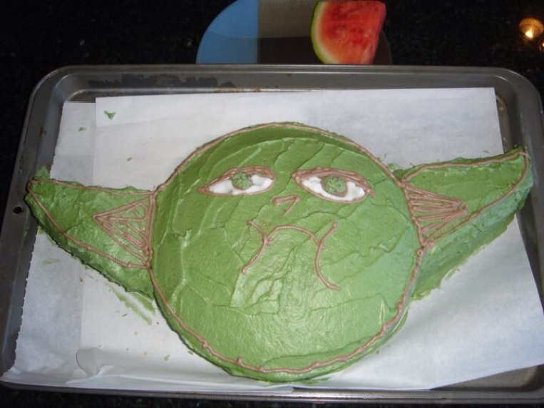 Yoda! Used two round pans and one square pan. Drew on the face with a toothpick and then piped on the icing.